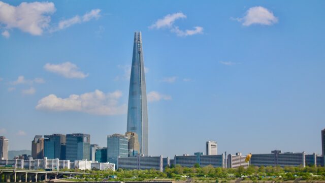 a very tall building towering over a city